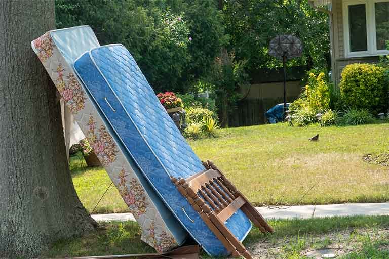 mattress disposal and recycling collection service - two mattresses on curb