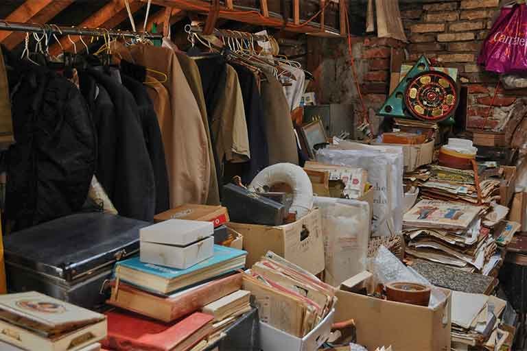 old cluttered attic in need of attic cleanout services from Garbage Gurus