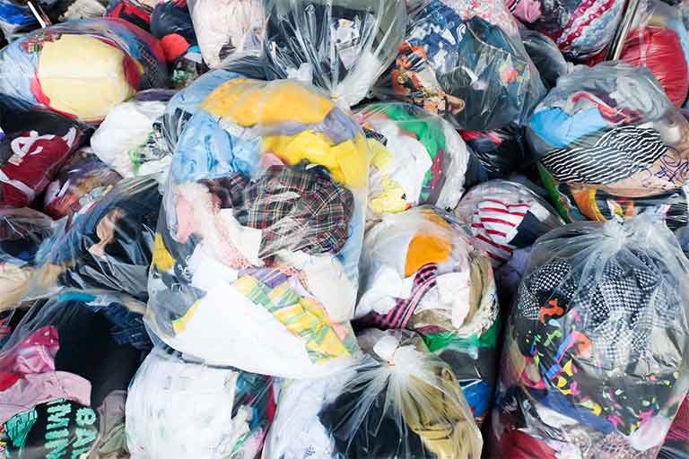 pile of clothes awaiting textile disposal service from Garbage Gurus