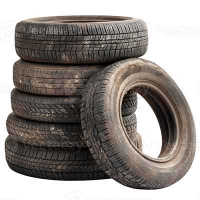 Stack of used vehicle tires, emphasizing tire removal services for garage and yard cleanouts.