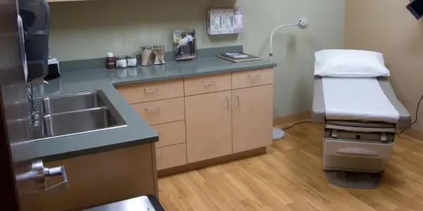 Empty examine room in doctors office representing junk removal services for medical offices and other businesses in the healthcare industry