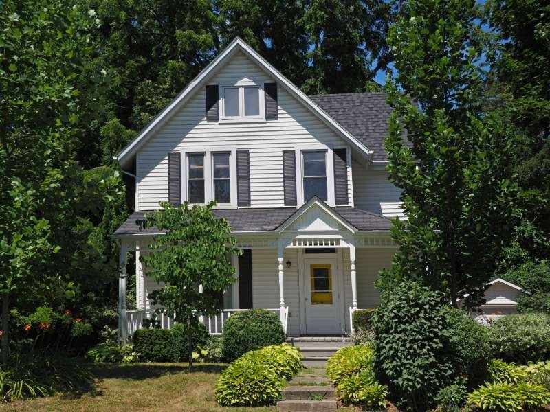 Exterior of a single family, Cape-style house representing estate cleanout service for homes in the North Central MA region