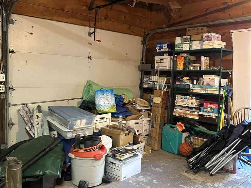 Cluttered garage space representing Garage Cleanout Service for homes in North Central MA